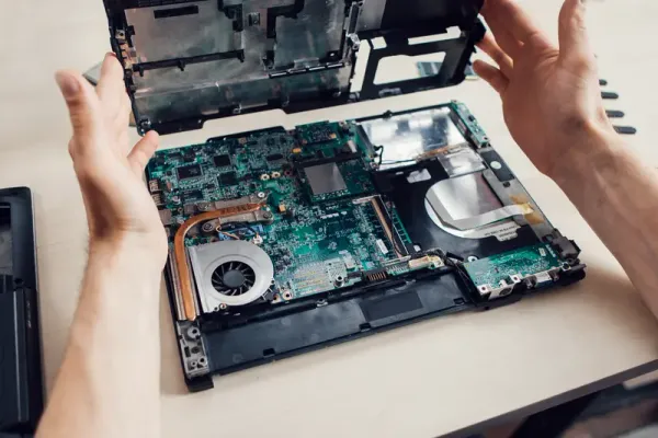 Technician repairing laptop